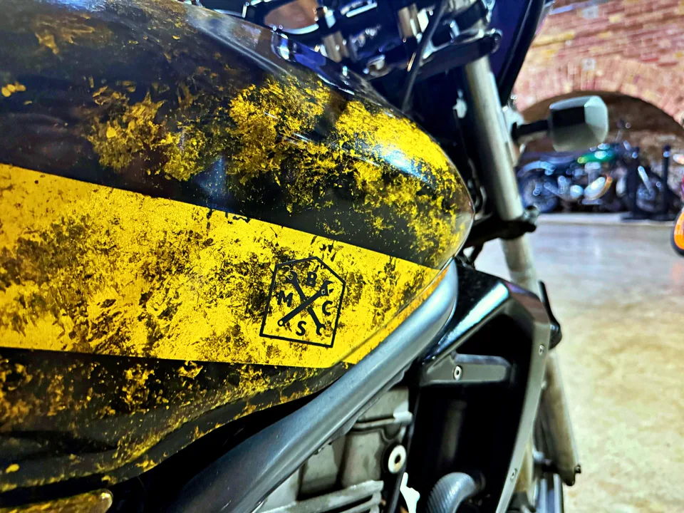 Gold and black motorcycle fuel tank