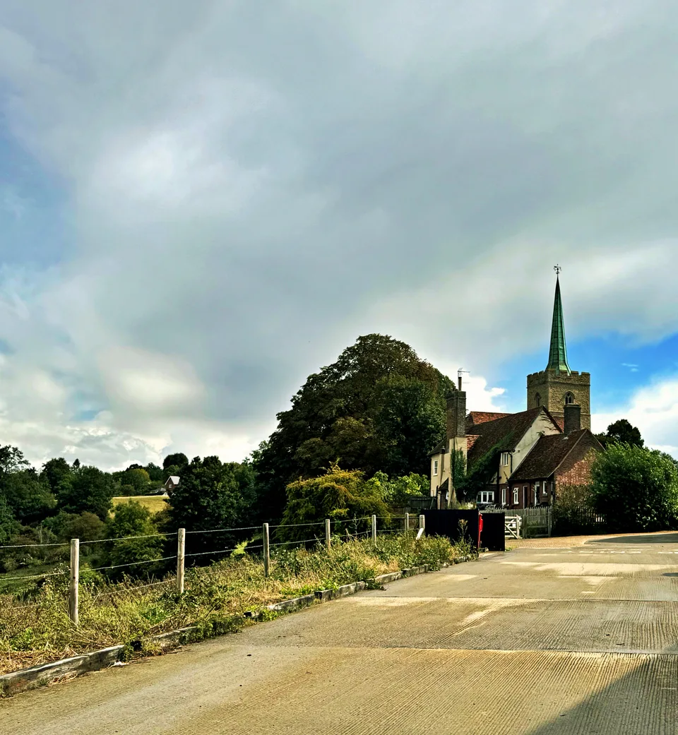 Village church beneath an overcast sky