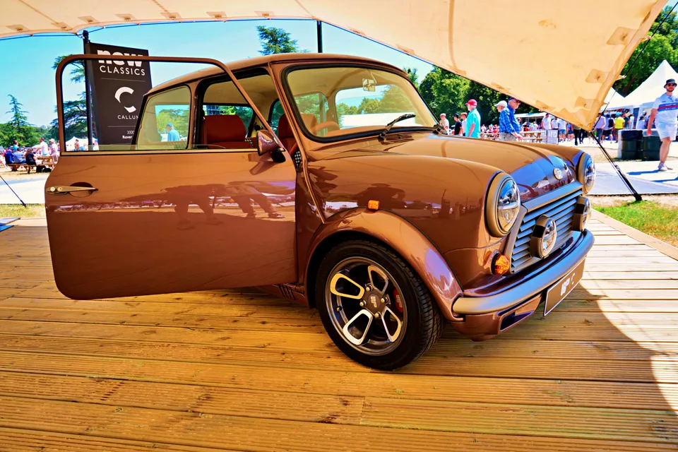 Brown classic Mini with its door open